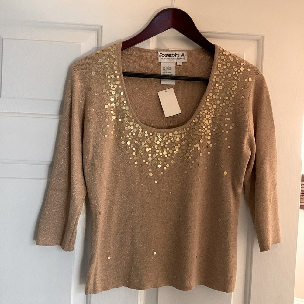 Holiday style top. Gold threading and sequins make it festive.